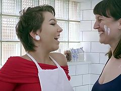 Australian lesbian girls, shaved Ripley and hairy Violette, lick each others pussies while making cookies in the kitchen