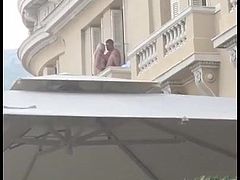 Man fucks blond slut over balcony