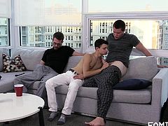 Looks like these horny gay men decided to show this inexperienced guy how real gay love feels like... While he sucks on his neighbour's fat dick, another guy penetrates his tight virgin asshole. Rough threesome on the couch!