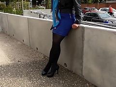 Nice lady in tight skirt walking outside