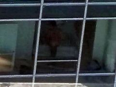 nude guy on window