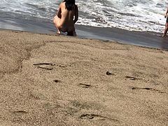asian nude playing at baker beach 0