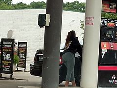 Brunette in tights at the gas station