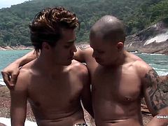 On a beautiful island, the waves crash around them as Latin studs Tomy and Kenzo bareback fuck on the rocks. Kenzo is first to take it up the ass, but soon hes taking a turn topping. The horny guys continue to flip fuck each other until both end up wearing the others cum load on his face. All that sticky mess is sure to get washed off and the naked young men swim back to their boat.