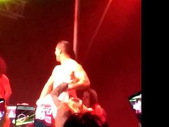 Male stripper get showered by two ladies from the audience