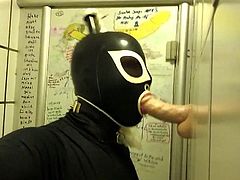 Rubberdoll Monique - Blowjob training in a public toilet