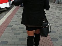 Pantyhose with overknee boots on the street