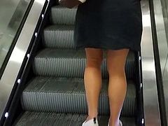 Glossy pantyhose on escalator