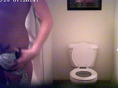 GF UNAWARE PISSING ON THE TOILET B4 SHOWER 1 OF Many