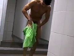 Hot guy drying himself after shower in locker room