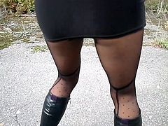 Leather boots, nylon tights and mini skirt