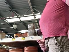 Bear public cum in a hardware store