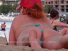 MILF on the beach, hidden camera voyeur