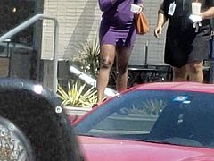 Lady wearing short purple skirt