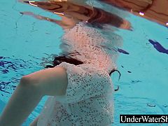 Russian teen Katy Soroka doing an underwatershow in a white dress