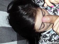 Asian amateur wife gives a handjob and takes a facial