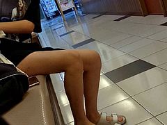 Sweet asian teen changing shoes