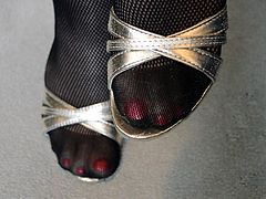 Feet in RT Fishnet Pantyhose & High Heels Close Up