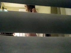 Spying on gorgeous teen girl through window blind - part 2