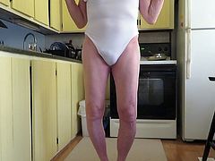 Sissy slut shows his fem ass cheeks in a woman's leotard.