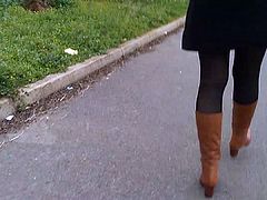 Upskirt stocking high boots on the street