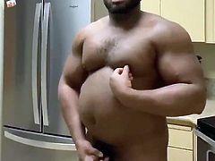 Black muscle chub plays with his cock