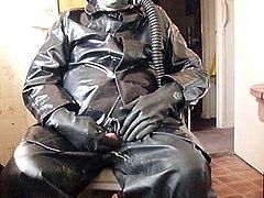 Rubber and oilskin cock play