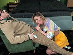 This horny blonde babe saw her nerdy neighbour's huge cock last night by accident when he was in his pyjamas, and today, she invited him to her house to seduce him. She gave the nerd a lap dance to get him all hard, and as soon as he got a boner, she quickly sucked the big cock off and started to ride it rough.