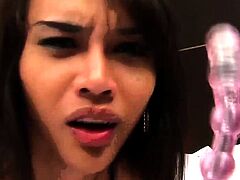 Teen ladyboy with monster cock plays with two dildos in her